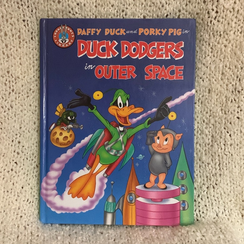 Looney Tunes book with Daffy Duck and Porky Pig.